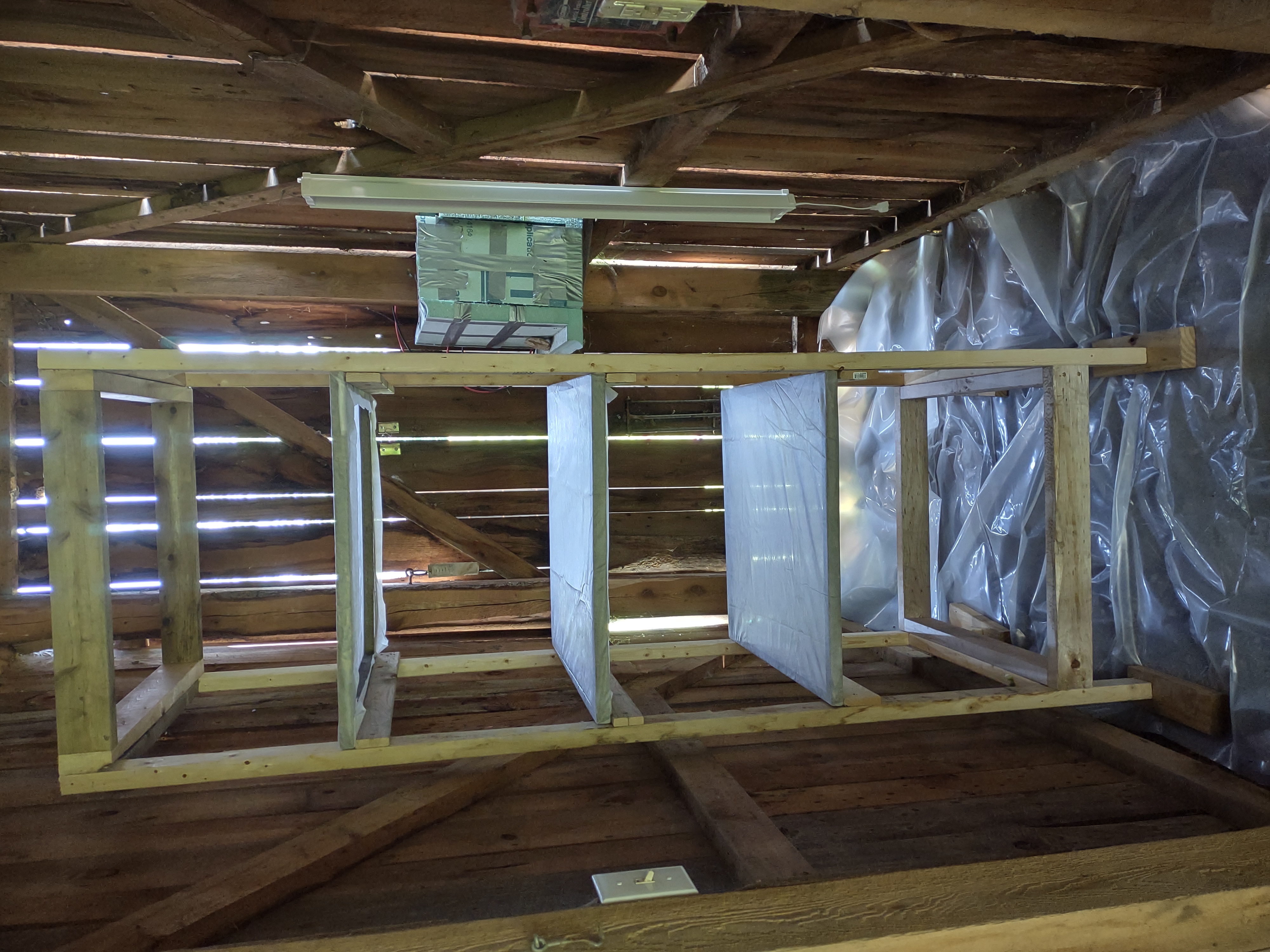 The drying rack with shelves inside the barn room from part I